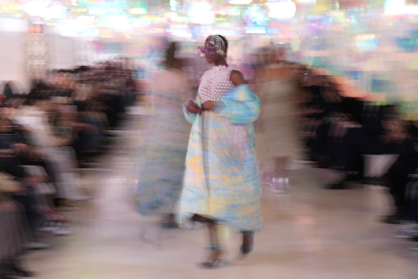 A model wears a creation as part of the Susan Fang Fall/Winter 2025-2026 Women's collection presented in Milan, Italy, Sunday, March 2, 2025. (AP Photo/Antonio Calanni)