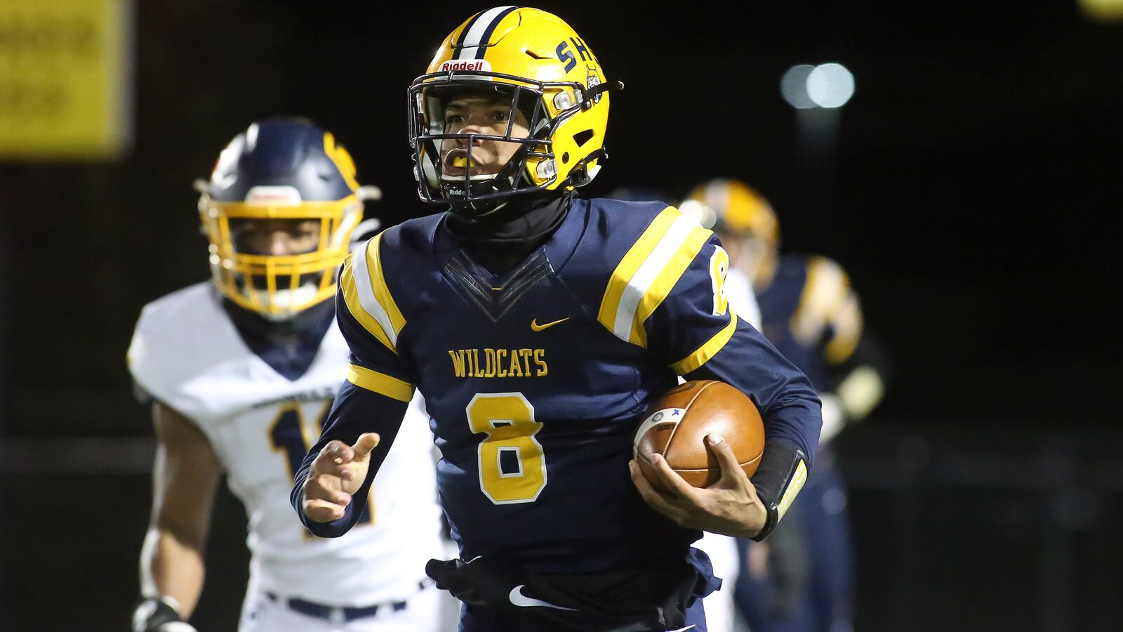 Springfield High School senior Te'Sean Smoot runs the ball during their 22-21 victory over Cincinnati Moeller in a D-I state semifinal game on Friday night at Sidney Memorial Stadium. Michael Cooper/CONTRIBUTED