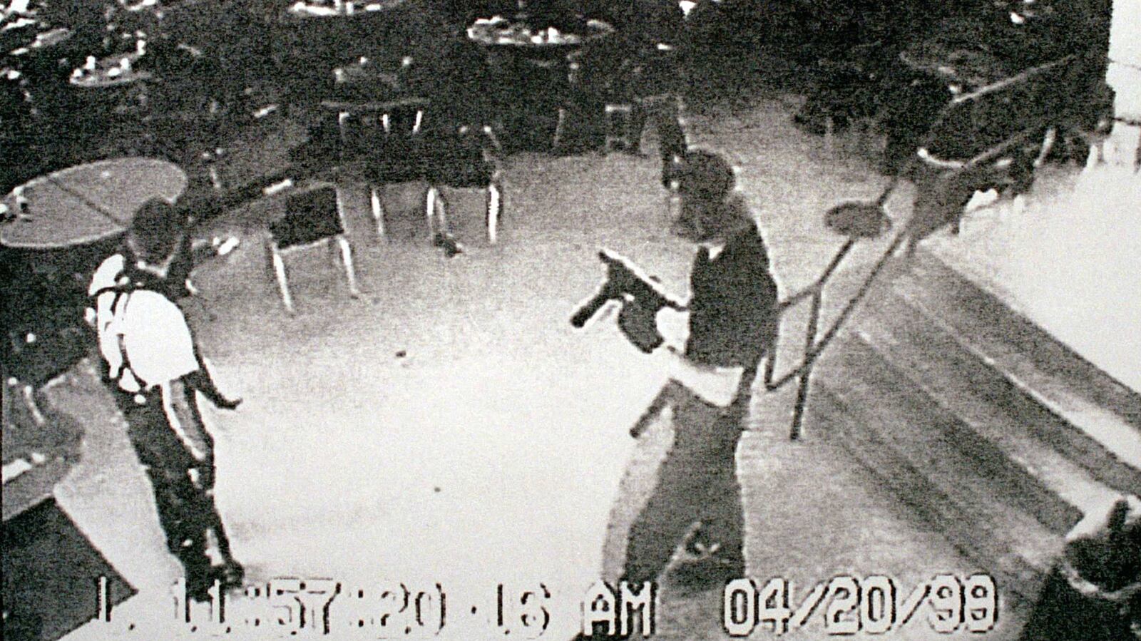 Columbine High School gunmen Eric Harris, left, and Dylan Klebold appear in a video capture of a surveillance tape from the school's cafeteria, where the teens began their shooting rampage on April 20, 1999. Harris, 18, and Klebold, 17, killed 12 students and a teacher at their Littleton, Colorado, high school before killing themselves. At the time, it was the worst school shooting in American history.