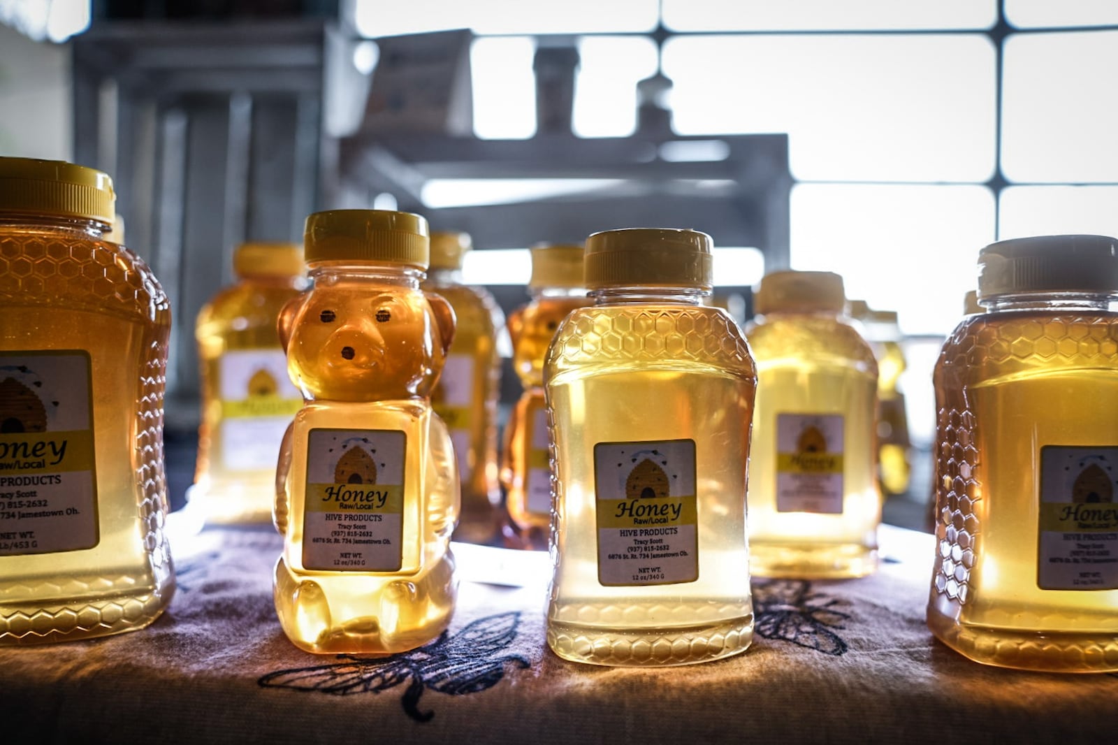 Beekeeper Tracy Scott from Jamestown sells his raw honey at the 2nd Street Market. JIM NOELKER/STAFF