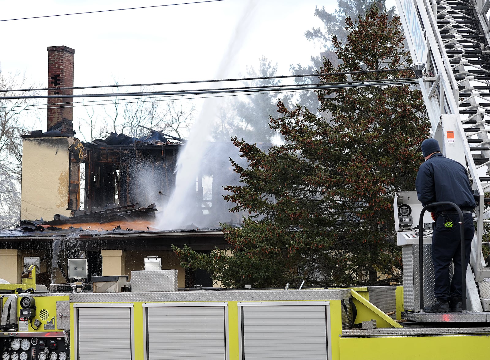 A vacant house was destroyed after an early morning fire in the 1300 block of Huffman Avenue in Dayton, Wednesday morning, Nov. 29, 2023. Officials ordered an emergency demolition. MARSHALL GORBY\STAFF