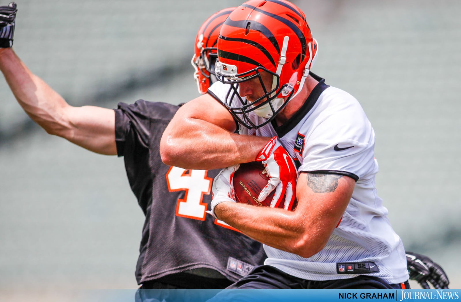 Cincinnati Bengals tight end Matt Lengel makes a catch defended by safety Clayton Fejedelem on the first day of mandatory mini camp Tuesday, June 14, 2016, at Paul Brown Stadium in Cincinnati. NICK GRAHAM/STAFF