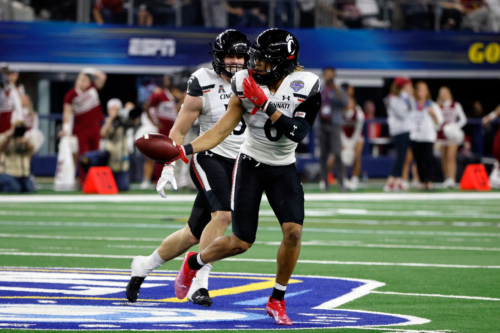 Cincinnati safety Bryan Cook (6) celebrates after intercepting a pass against Alabama during the second half of the Cotton Bowl NCAA College Football Playoff semifinal game, Friday, Dec. 31, 2021, in Arlington, Texas. (AP Photo/Michael Ainsworth)