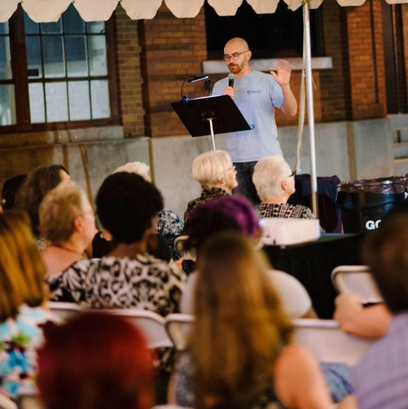 Arch Grieve, a mediation specialist at the Dayton Mediation Center, is the new chair of the Dayton Sister City Committee and is vice president of the Dayton Council on World Affairs. He is pictured giving a talk for PechaKucha Dayton.