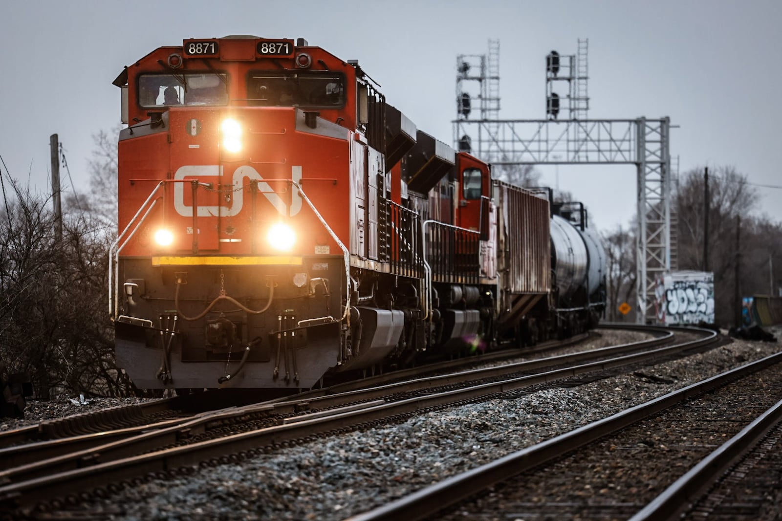 A Canadian National Railway freight train rolls through the heart of Dayton Wednesday February 22, 2023. JIM NOELKER/STAFF