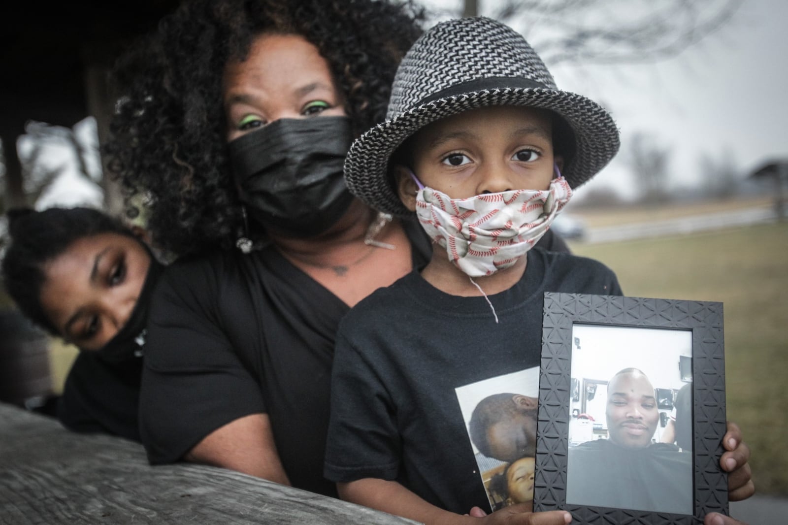 Tierra Copper, center, lost her husband Eberechukwu to COVID-19 in December. A service was held at Arthur O. Fisher Park for his life. Eberechukwu's children are Evere Cooper, left and King Cooper.