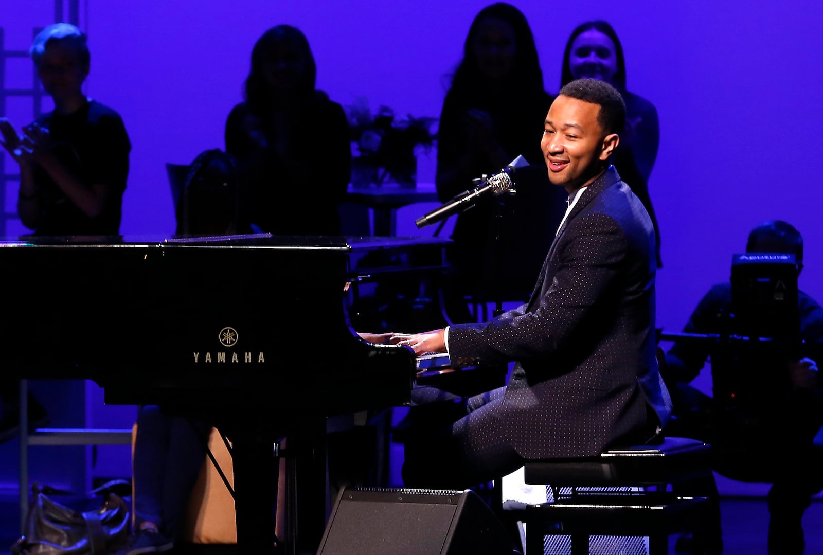 John Legend performs on stage during a concert following the ribbon cutting for the new John Legend Theater Sunday. Bill Lackey/Staff