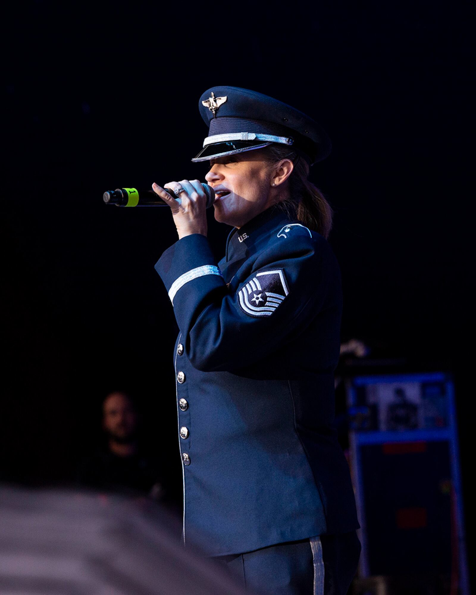 Master Sgt. Christin Foley, U.S. Air Force Band of Flight vocalist, sings the national anthem before a Hometown Heroes military appreciation concert Aug. 11 at Fraze Pavilion in Kettering. U.S. AIR FORCE PHOTO/JAIMA FOGG