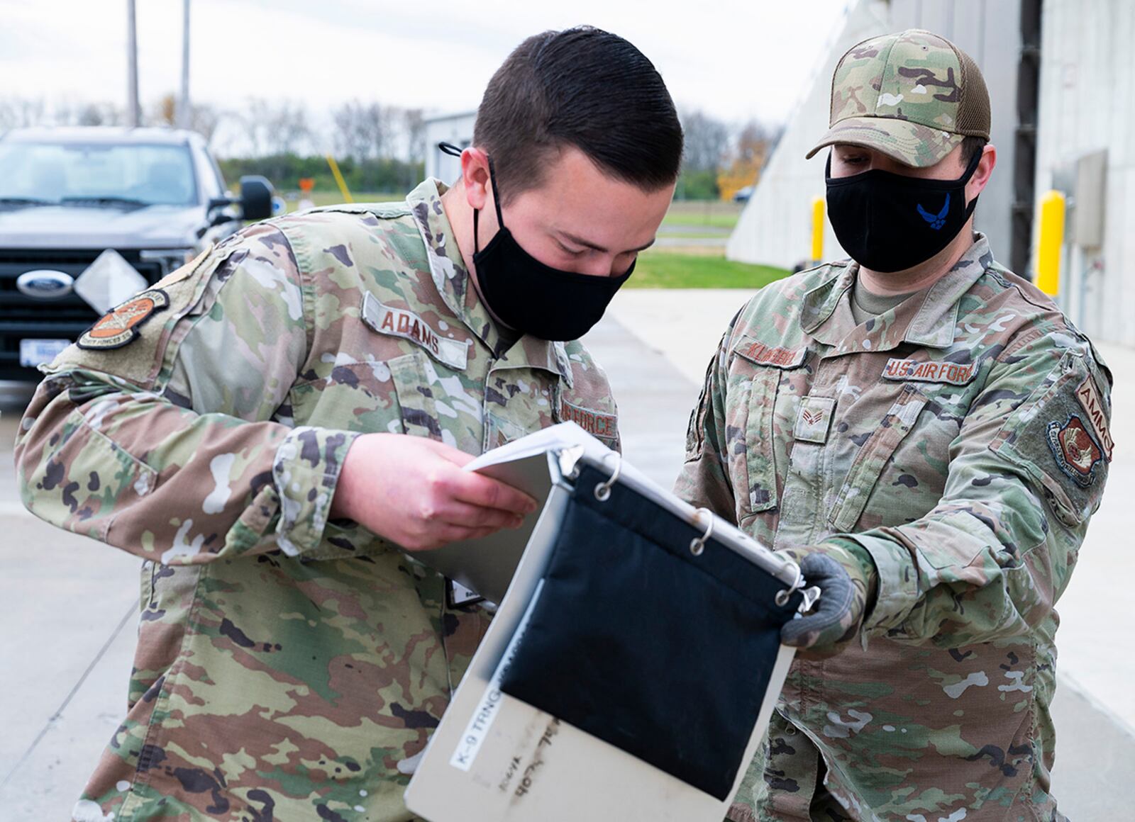 Senior Airman Ryan Klingbeil (right), 88th Operations Support Squadron Munitions Flight inspector, has Staff Sgt. Tyler Adams, 88th Security Forces Squadron dog handler, sign for issued explosives Nov. 17 at Wright-Patterson Air Force Base. Part of the Munitions Flight’s mission is to track and account for every piece of ammunition on Wright-Patt. U.S. AIR FORCE PHOTO/R.J. ORIEZ