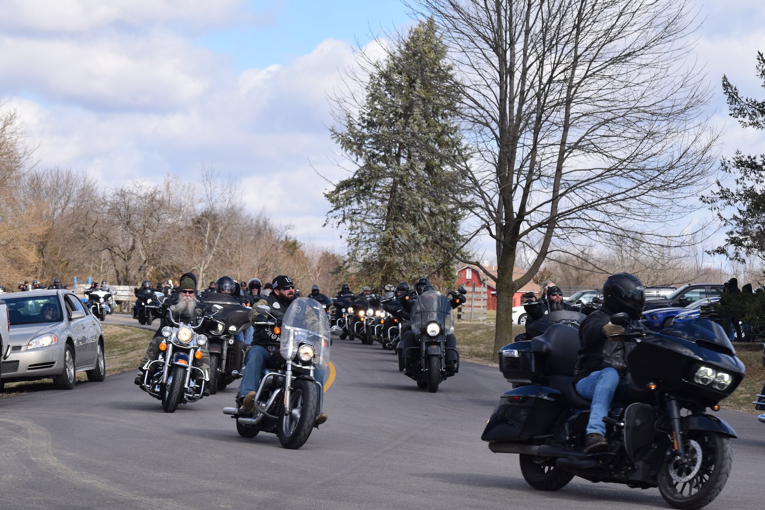 PHOTOS: Thousands of Outlaws attend motorcycle gang leaders funeral at Montgomery County Fairgrounds.