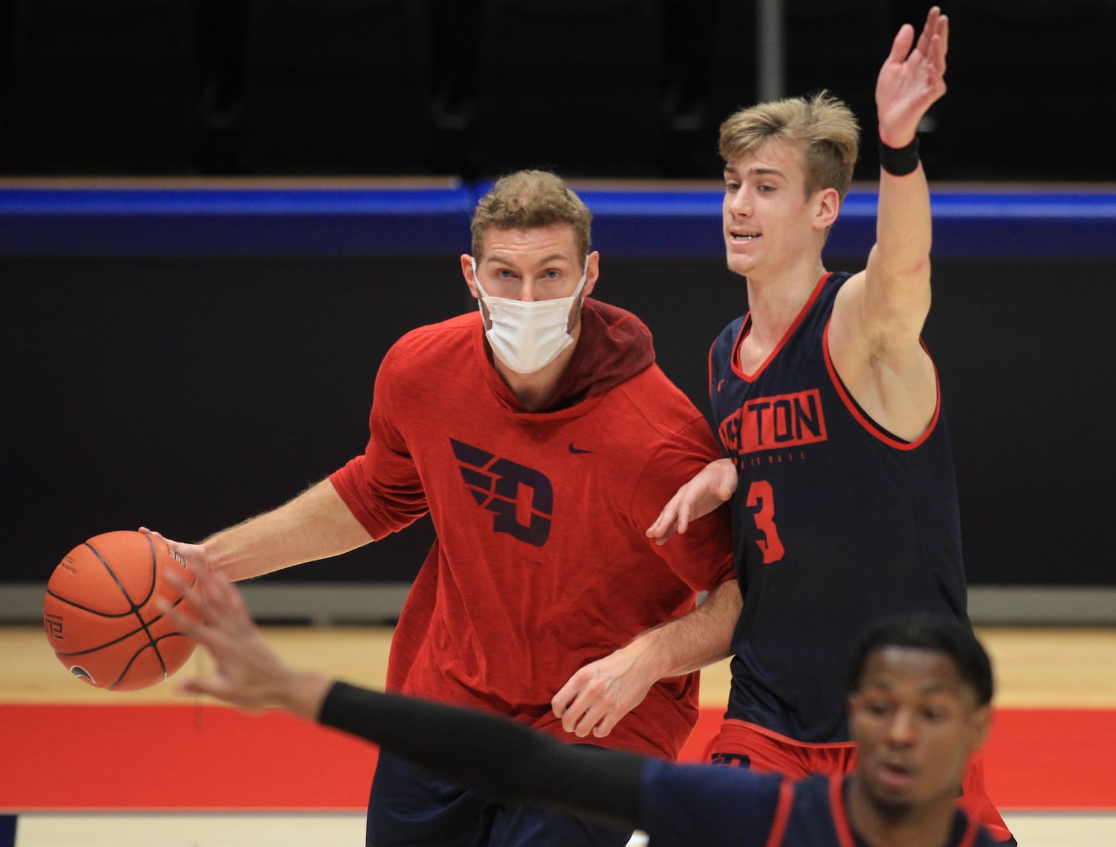 Dayton's Lukas Frazier, right, defends Sean Damaska during practice at UD Arena on Thursday, Nov. 5, 2020. David Jablonski/Staff