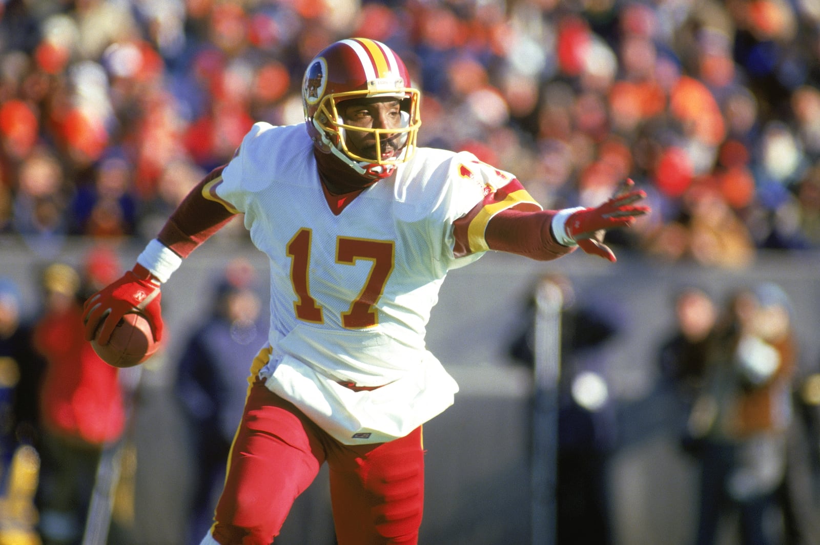 1987:  Doug Williams #17 of the Washington Redskins scrambles with the ball during a 1987 NFL season game. (Photo by: Jonathan Daniel/Getty Images)