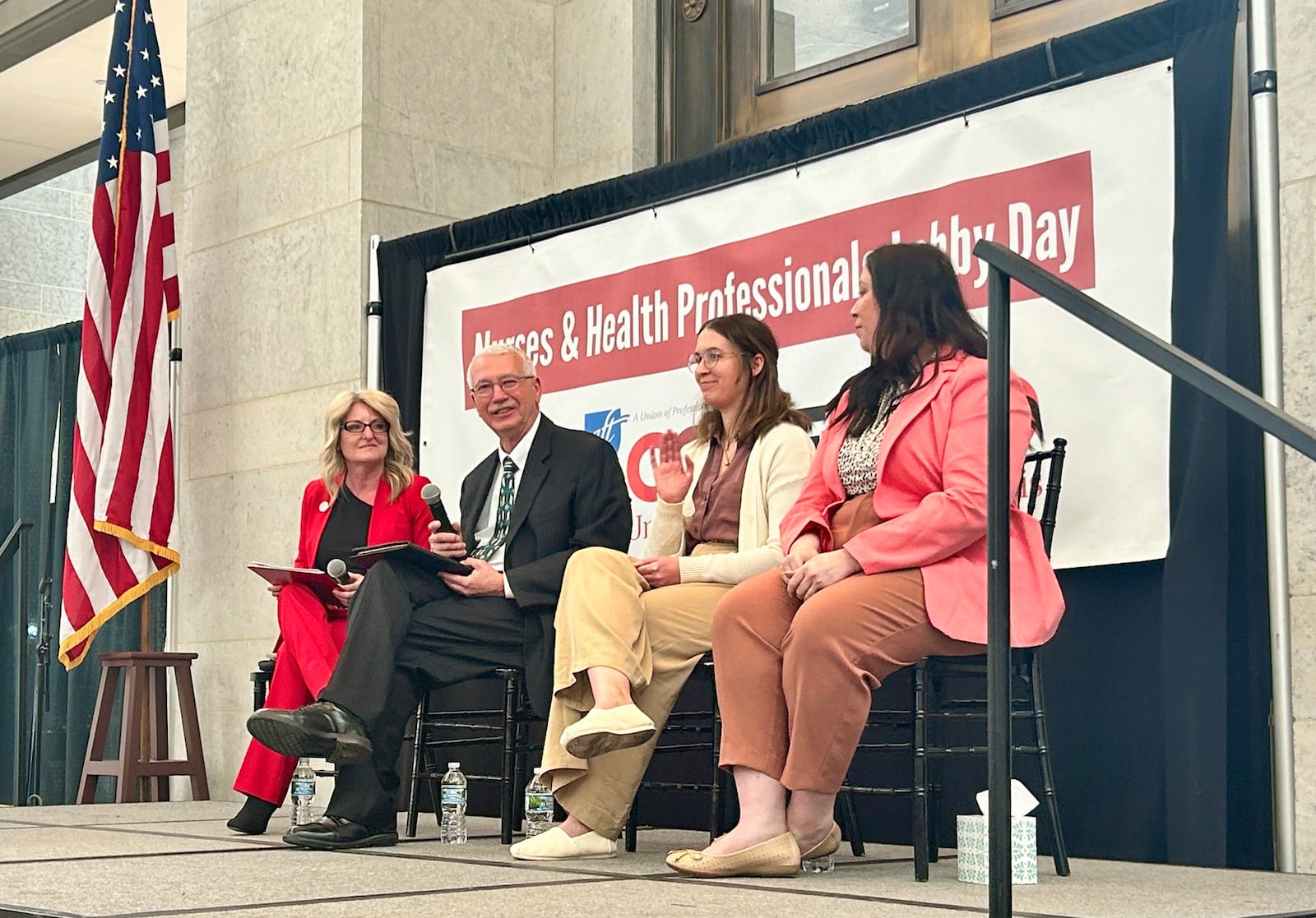 Ron Smith sits with two of his daughters to advocate for changes in the nursing industry and to remember Tristin Kate Smith, his daughter who rebuked the nursing industry's workloads before dying by suicide. Wednesday, April 29, 2024.