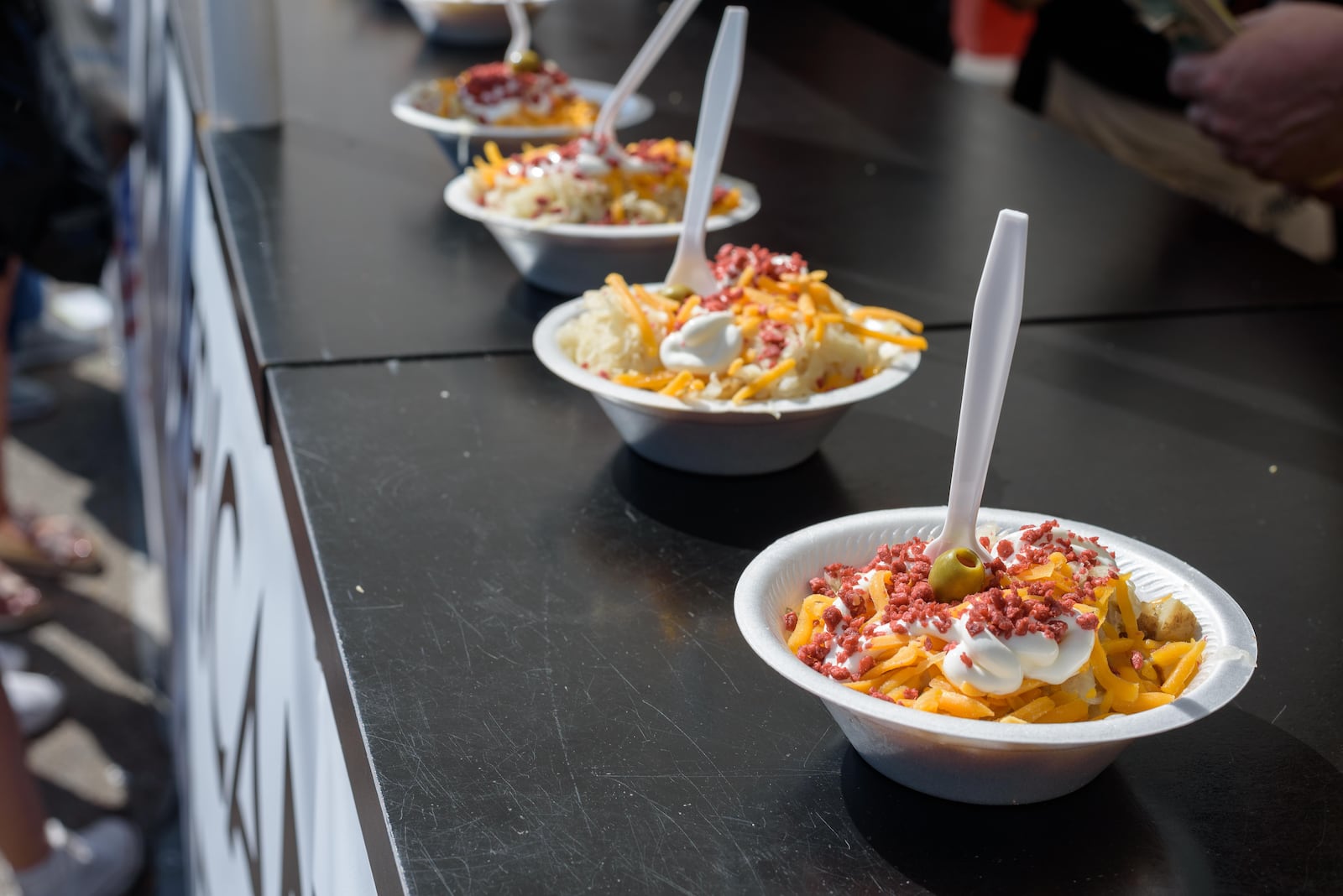 The Ohio Sauerkraut Festival features more than 30 nonprofit food booths and civic groups from the community serving over 11,000 pounds of Franks Sauerkraut. TOM GILLIAM/CONTRIBUTING PHOTOGRAPHER