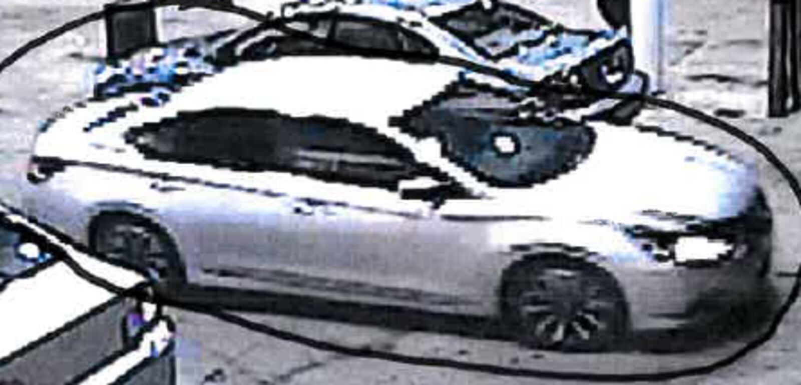 Silver Nissan Altima, possibly the vehicle the robbery suspect was driving.