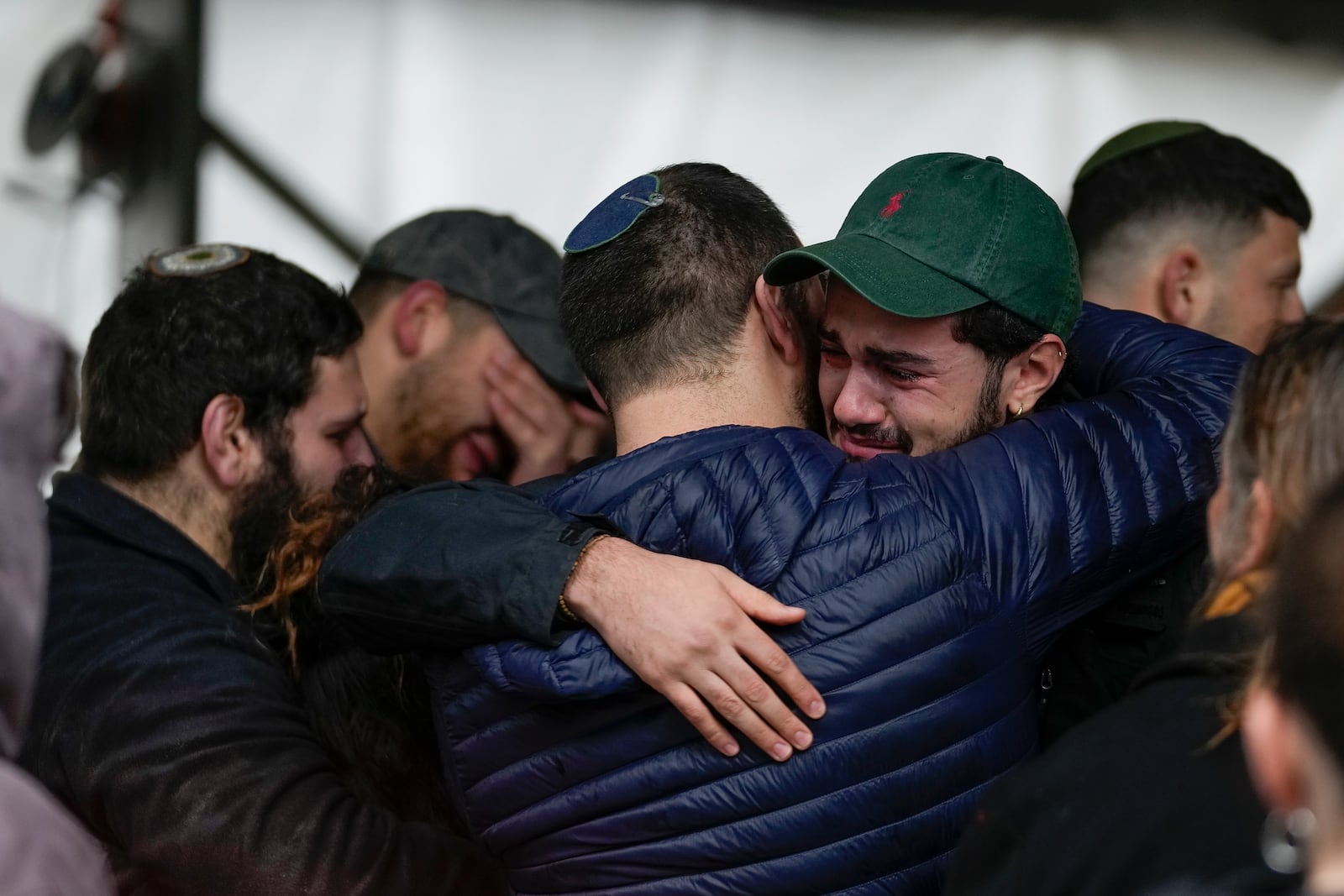 Mourners of 1st Sgt. Yuval Shoham attend his funeral at the Mount Herzl military cemetery in Jerusalem, Monday, Dec. 30, 2024. (AP Photo/Matias Delacroix)