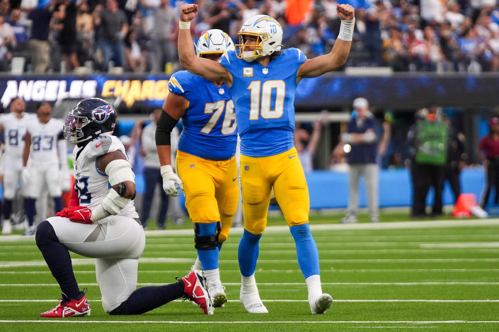 Los Angeles Chargers quarterback Justin Herbert (10) celebrates the team's touchdown during the second half of an NFL football game against the Tennessee Titans, Sunday, Nov. 10, 2024, in Inglewood, Calif. (AP Photo/Mark J. Terrill)