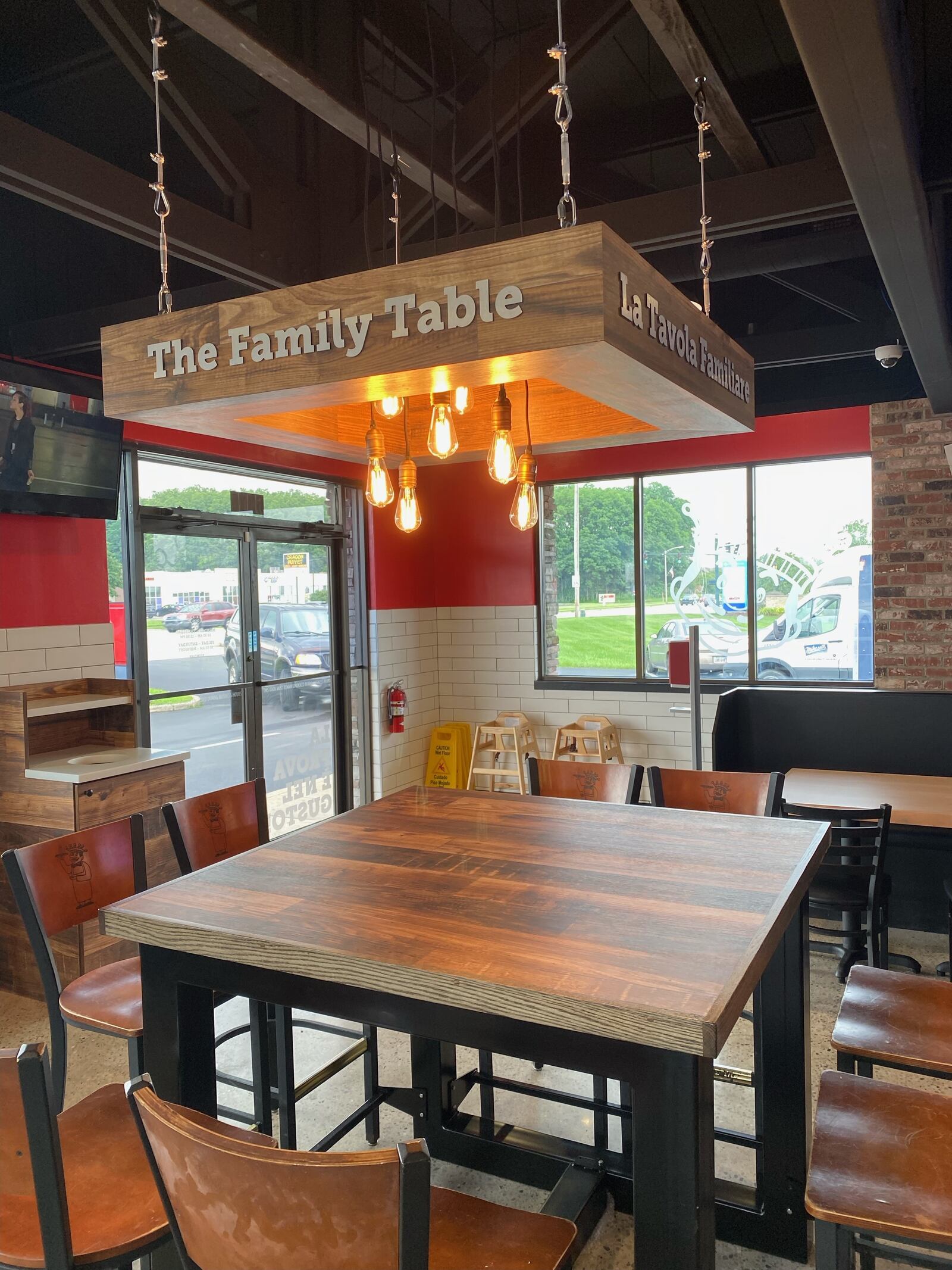 The new location at 6315 Brandt Pike in Huber Heights features a family table, history wall and pick-up window. SHARON WILMORE/STAFF