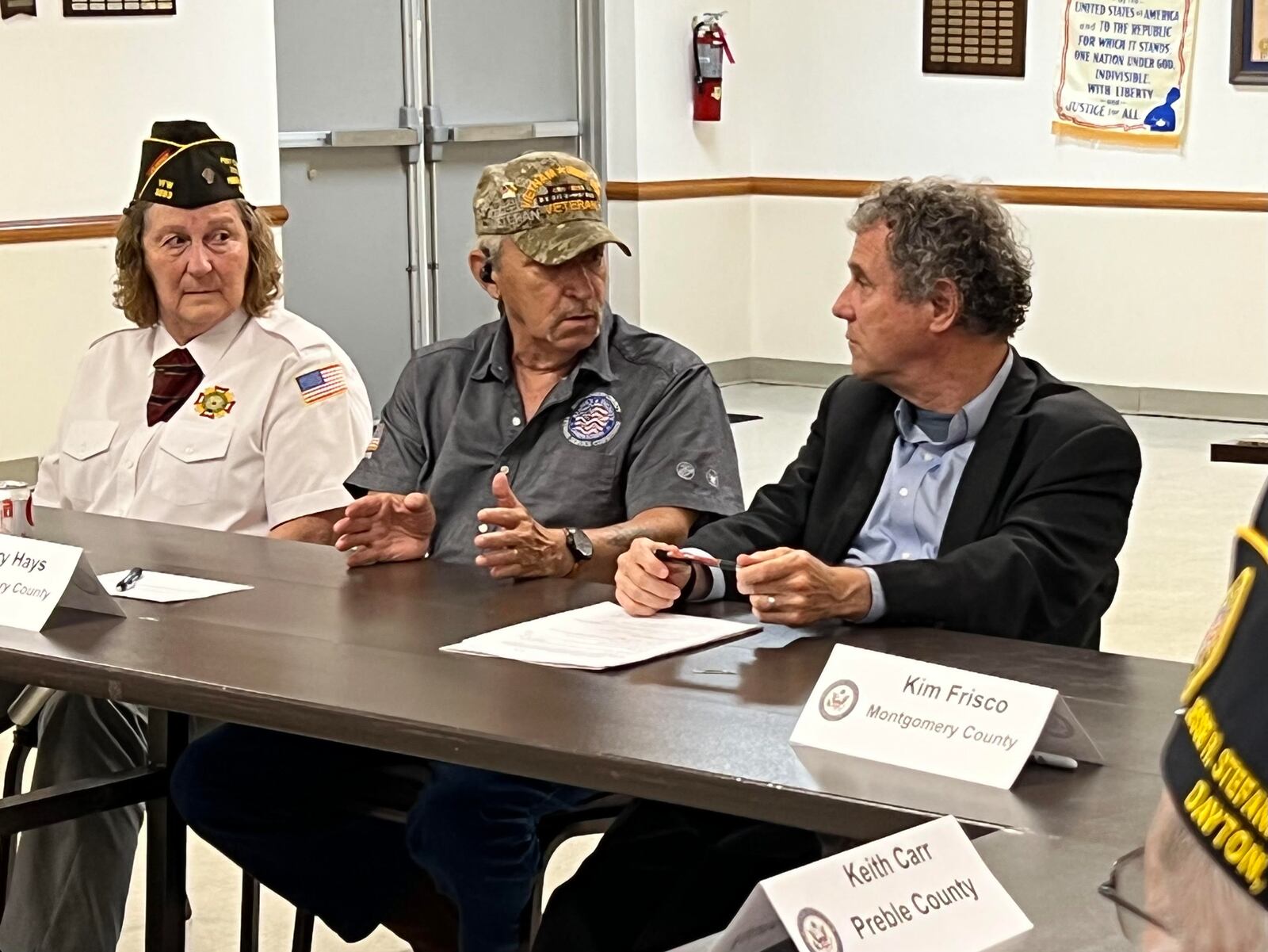 Sen. Sherrod Brown (right) speaks with local veterans regarding about the PACT Act, an expansion of health care benefits for those affected by illnesses related to toxic chemical exposure during their time in the service. AIMEE HANCOCK/STAFF