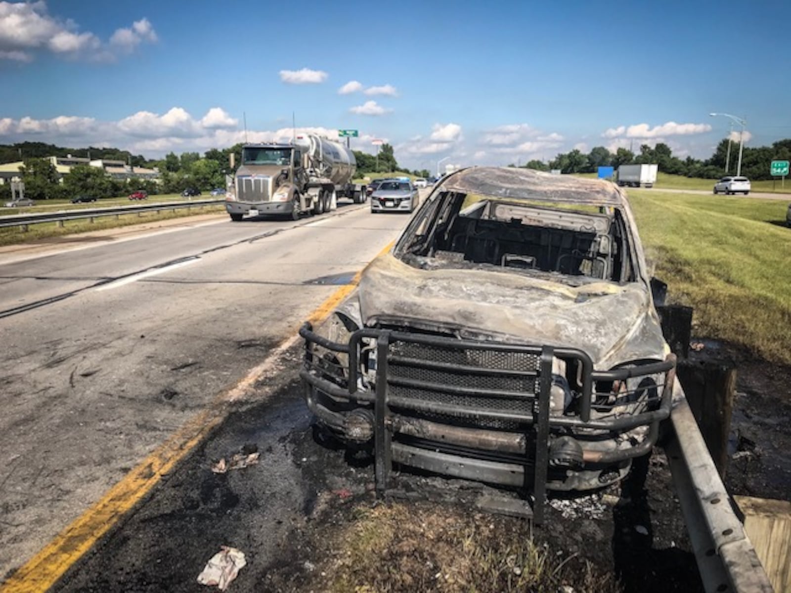 The driver of this pickup truck suffered non-life-threatening burns Thursday afternoon, June 28, 2018, when the transmission exploded into flames on I-70 West in Springfield. (Jim Noelker/Staff)