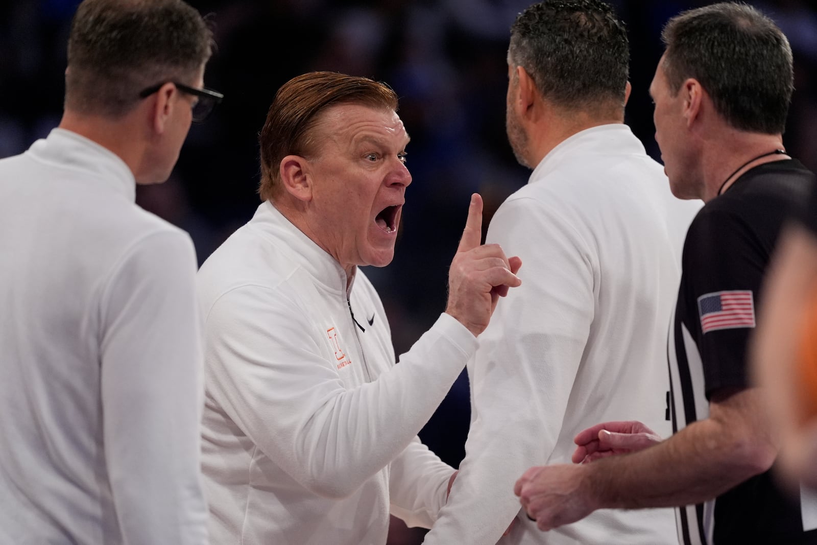 Illinois head coach Brad Underwood argues a call during the first half of an NCAA college basketball game against Duke Saturday, Feb. 22, 2025, in New York. (AP Photo/Frank Franklin II)