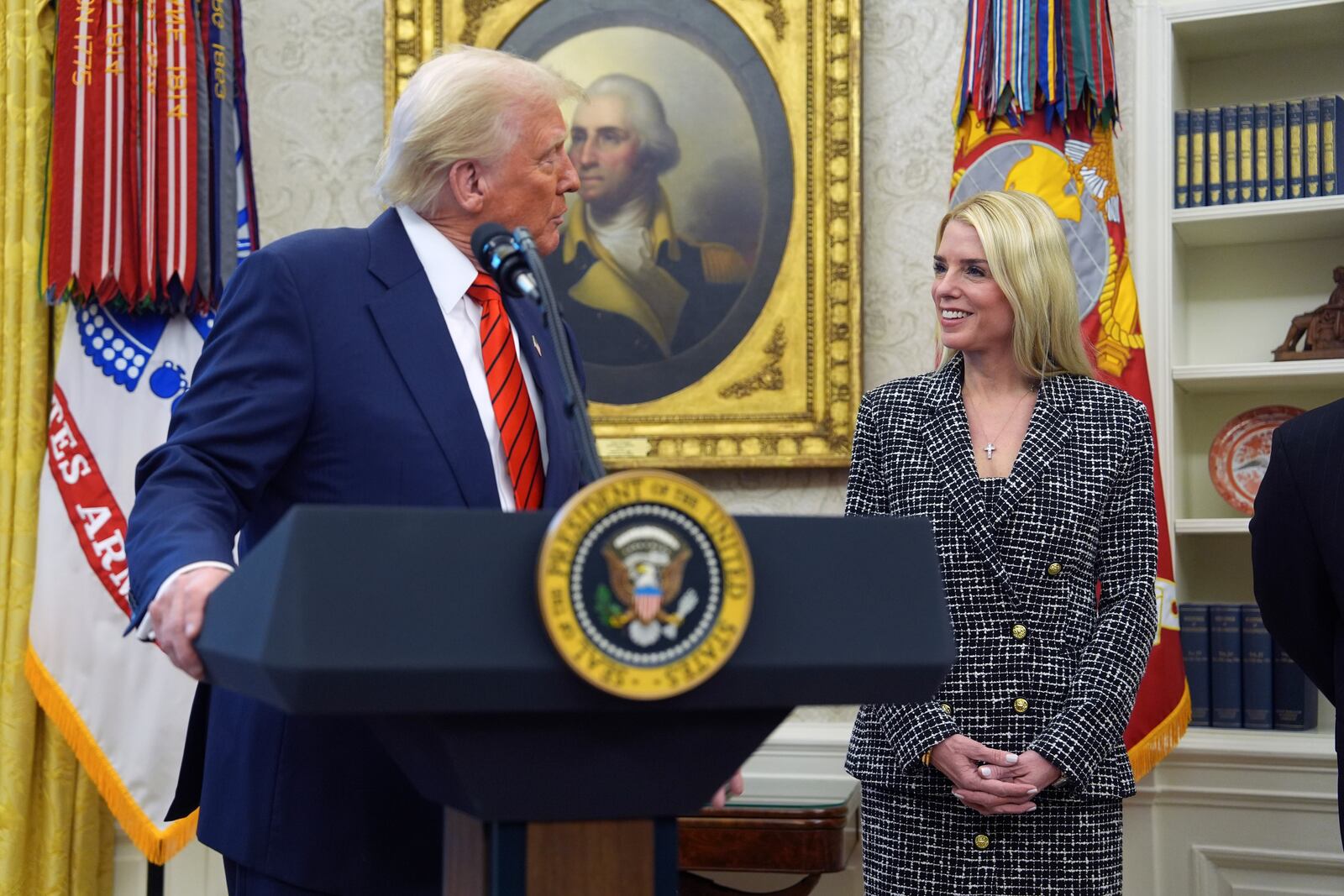 President Donald Trump welcomes Pam Bondi before she is sworn in as Attorney General by Supreme Court Associate Justice Clarence Thomas, in the Oval Office of the White House, Wednesday, Feb. 5, 2025, in Washington. (AP Photo/Evan Vucci)