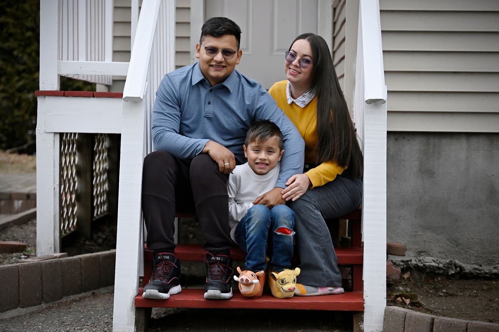 FILE - In this Jan. 3, 2025, photo, Rogers Lopez, sits with his wife Karina Canizarez, right, and son Jesus David outside their apartment in New Milford, Conn. (AP Photo/Jessica Hill, File)