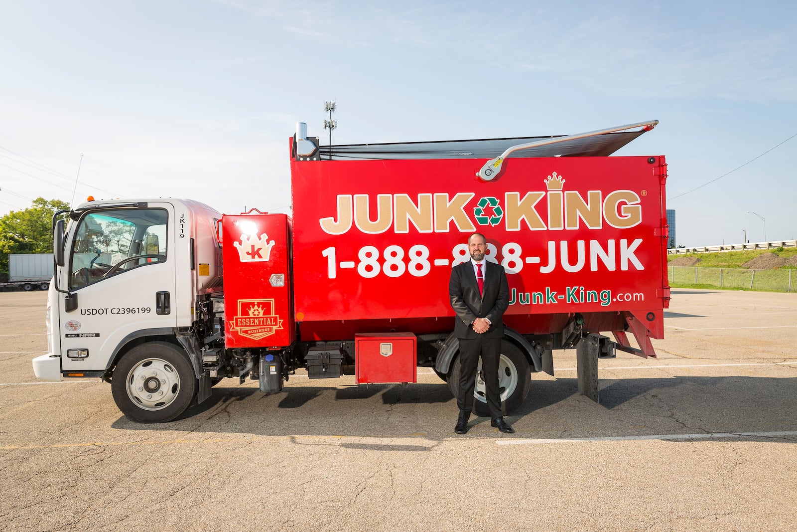 Jack Brendamour with one of the Junk King trucks. He took over leadership and part ownership of the company after his friend and mentor, Peter McCreary, passed away suddenly in 2018.