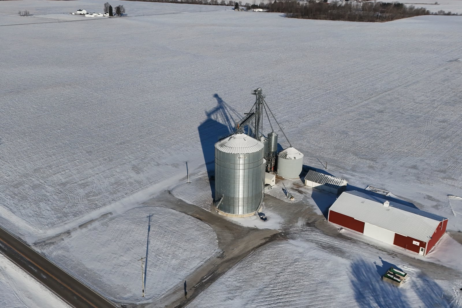 Snow blankets fields at Zoe Kent's farm, Monday, Jan. 20, 2025, in Bucyrus, Ohio. (AP Photo/Joshua A. Bickel)