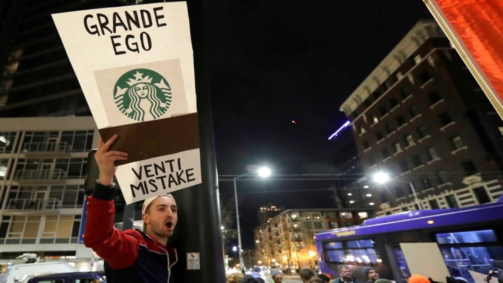 David Schwartz, of Bellevue, Wash., yells as he takes part in a protest outside a book-promotion event held by former Starbucks CEO Howard Schultz, Thursday, Jan. 31, 2019, in Seattle. Schultz has faced a rocky reception since he announced earlier in January that he's considering an independent presidential bid. 