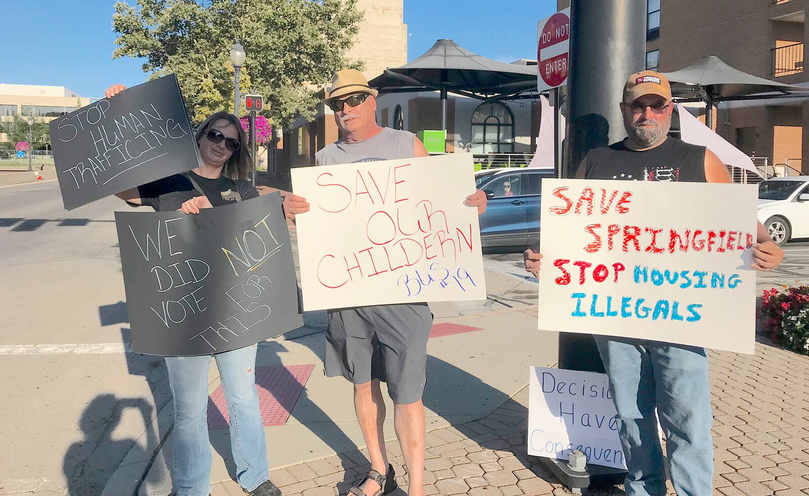 Pictured (from left) are Melissa and Jay Durst and a man who wished not to be identified who joined other Springfield residents expressing frustration following an Aug. 22 fatal school bus accident that resulted in vehicular homicide charges against Haitian immigrant Hermanio Joseph. Citizens demanded action from city officials, who say they have a limited role in addressing immigrant issues. CONTRIBUTED BY VICKY FORREST