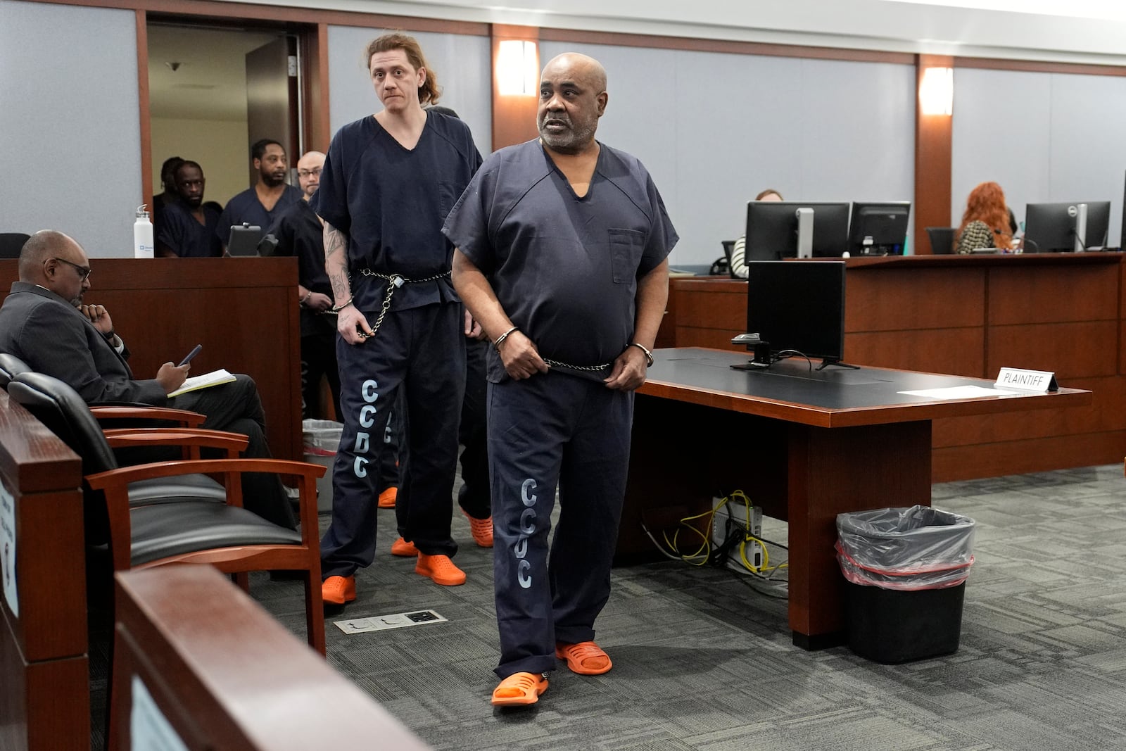 Duane "Keffe D" Davis, right, walks into District Court for a status check on trial readiness for his involvement in the 1996 killing of rapper Tupac Shakur, Tuesday, Feb. 18, 2025, in Las Vegas. (AP Photo/John Locher, Pool)