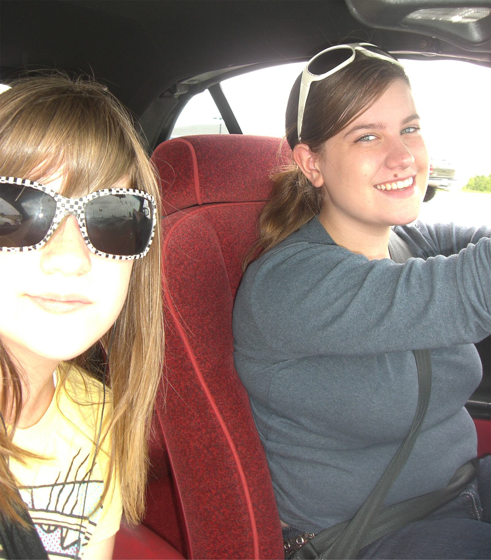 Bellinger has volunteered to help animals in need for many years. She is shown with her friend Brandy Stewart (L) on their way to pick up a husky from a rescue organization in southern Ohio in July of 2010.