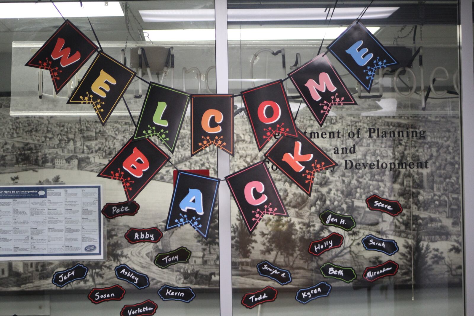 Colorful signs on the sixth floor welcome back city of Dayton planning and community development employees. The city suspended remote working for employees June 1. The city is merging departments and creating new divisions. CORNELIUS FROLIK / STAFF