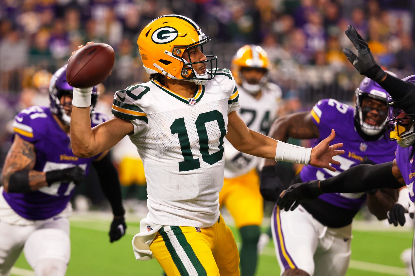 Green Bay Packers' Jordan Love throws during the second half of an NFL football game against the Minnesota Vikings Sunday, Dec. 29, 2024, in Minneapolis. (AP Photo/Bruce Kluckhohn)