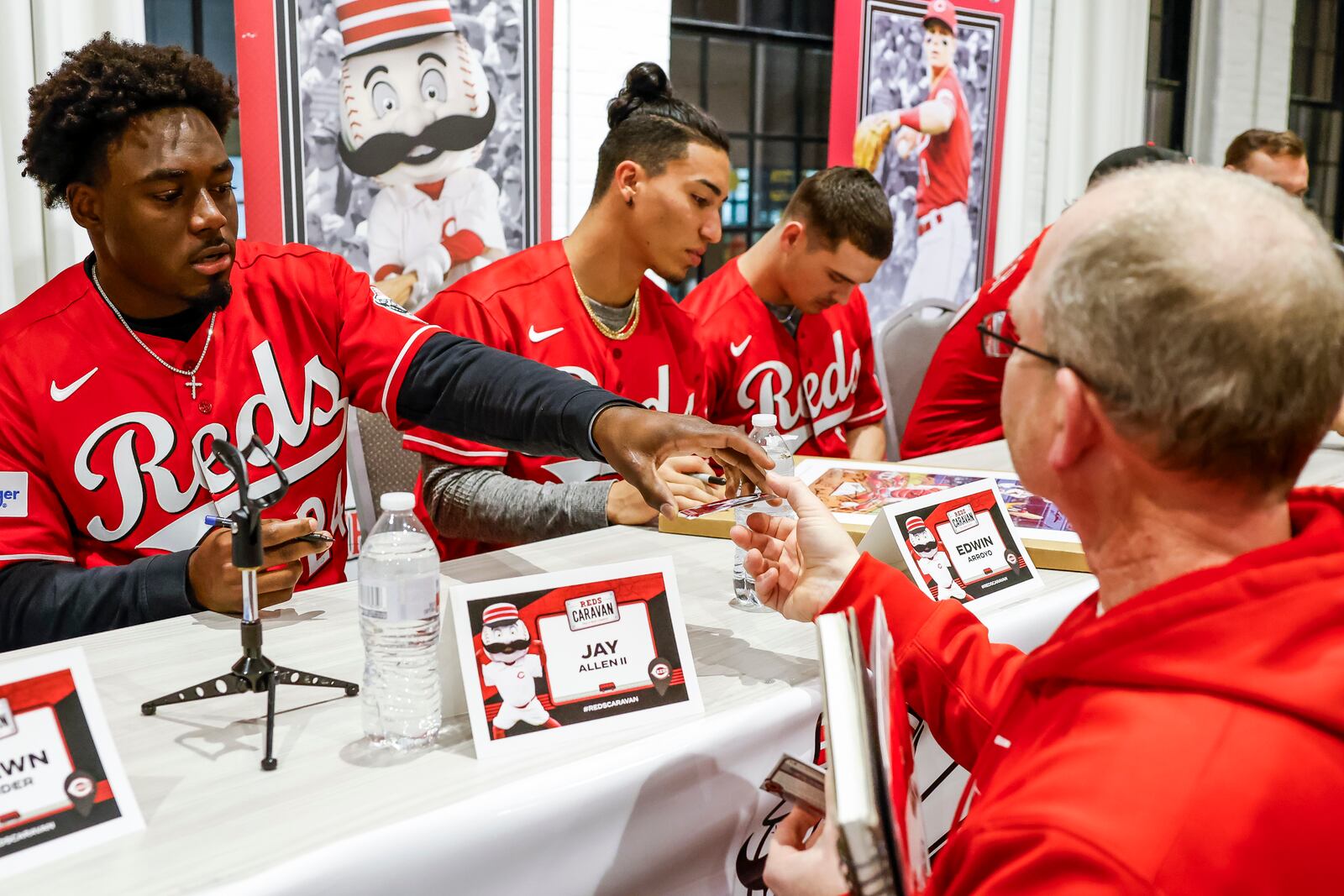 The annual Reds Caravan kicked off at Spooky Nook Sports Champion Mill Monday, Jan. 22, 2024 in Hamilton. Fans were able to ask questions and get autographs during the event.  Minor leaguers Jay Allen II and Edwin Arroyo sign autographs. NICK GRAHAM/STAFF