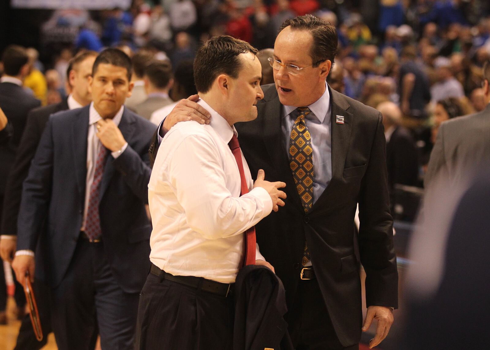 Dayton’s Archie Miller and Wichita State’s Gregg Marshall talk after a NCAA tournament game on Friday, March 17, 2017, at Bankers Life Fieldhouse in Indianpolis. David Jablonski/Staff