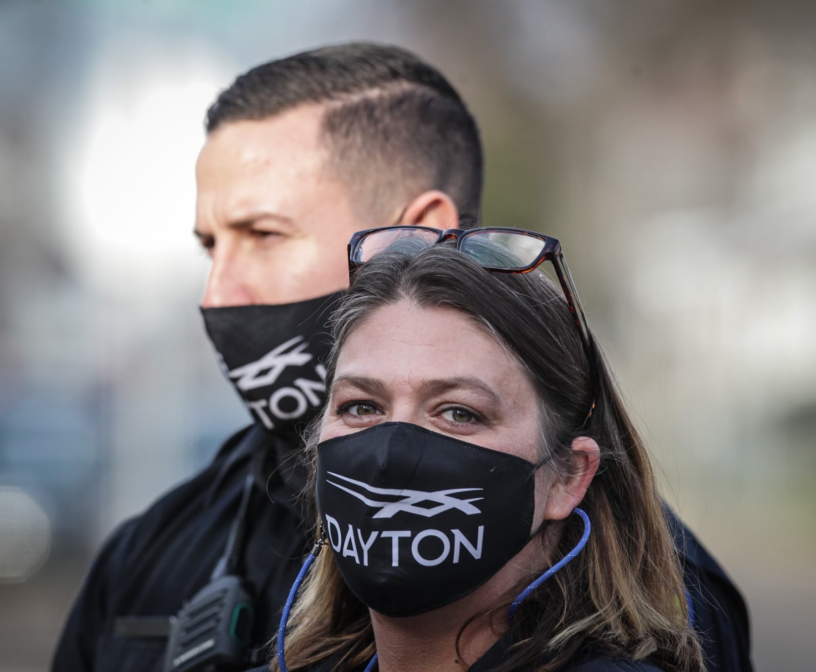 Dayton fire EMT, foreground, Amy Dunkin and Dayton police officer, Jeremy Campbell, along with other first responders, helped a struggling family in East Dayton.