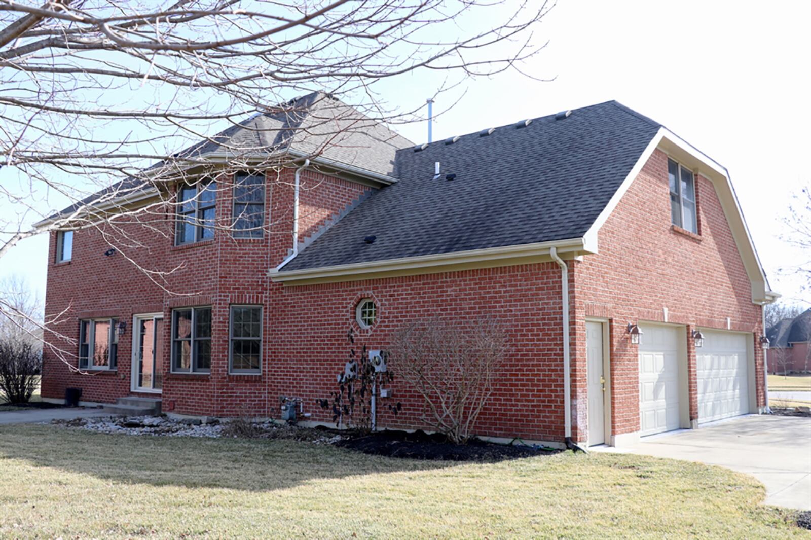 The brick 2-story is set on a corner lot and includes a side-entry, 3-car garage. Sliding patio doors open from the transition space between the great room and breakfast room to the rear patio and open back yard. CONTRIBUTED PHOTO BY KATHY TYLER