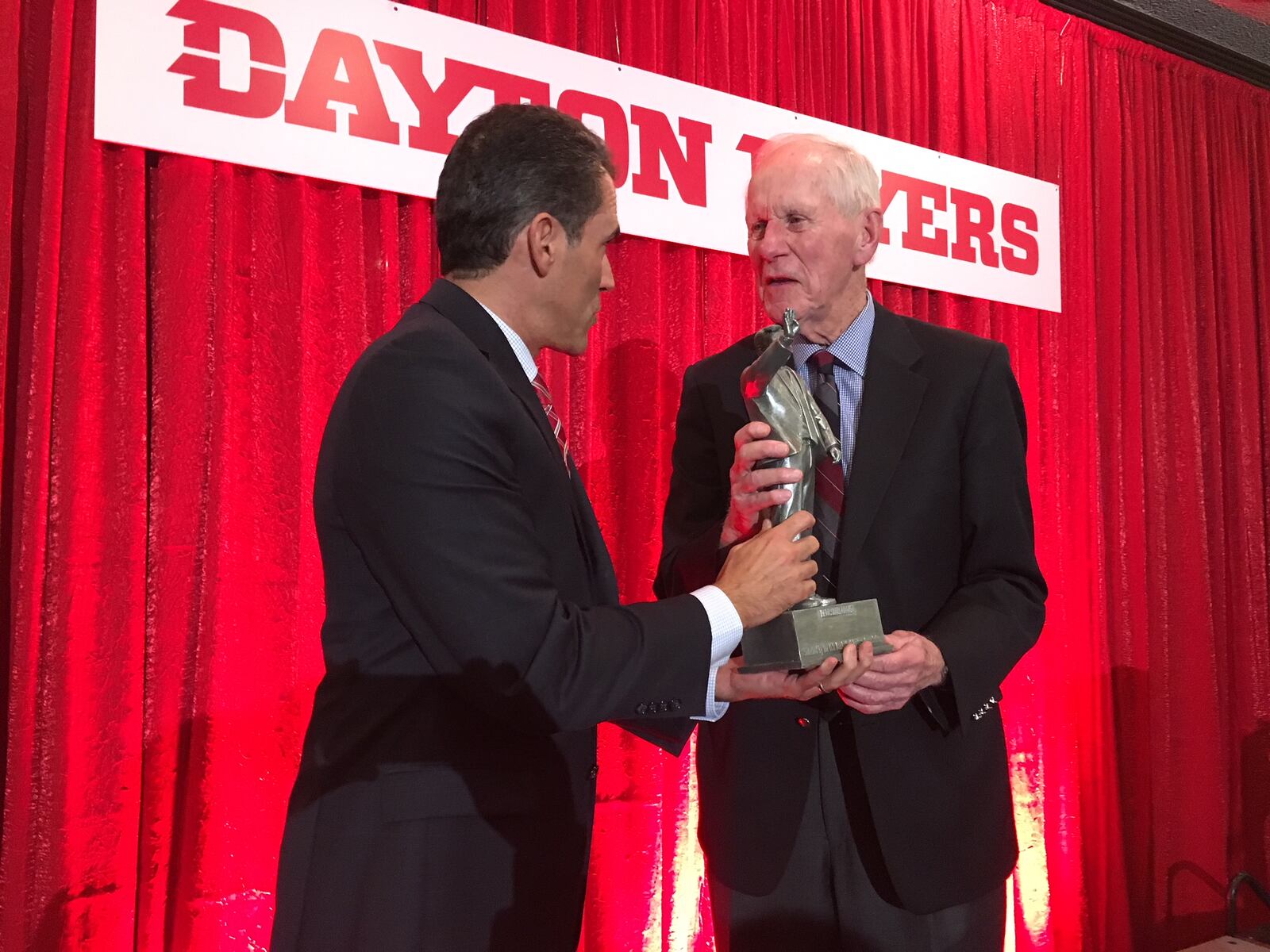 Former Dayton Flyers coach Don Donoher received the Dean Smith Award on Wednesday night from the U.S. Basketball Writers Association. Seth Davis (left) presented Donoher with the award. Mike Hartsock/STAFF