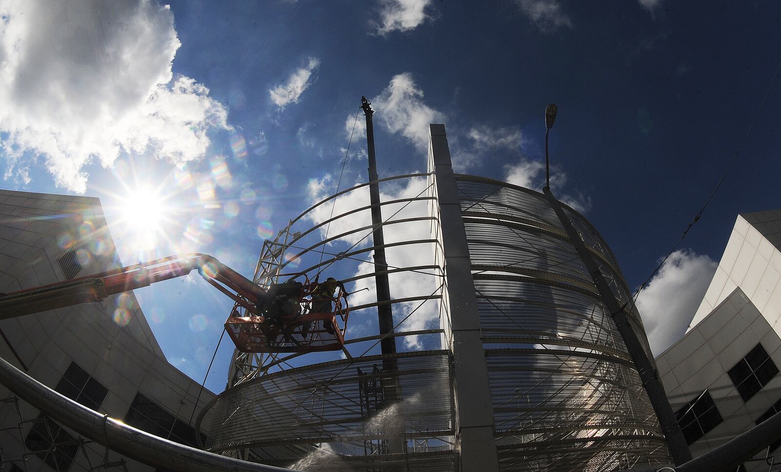 Demolition started early Tuesday morning Aug. 16, 2022 on the structure in front of the Dayton Convention Center. MARSHALL GORBY\STAFF