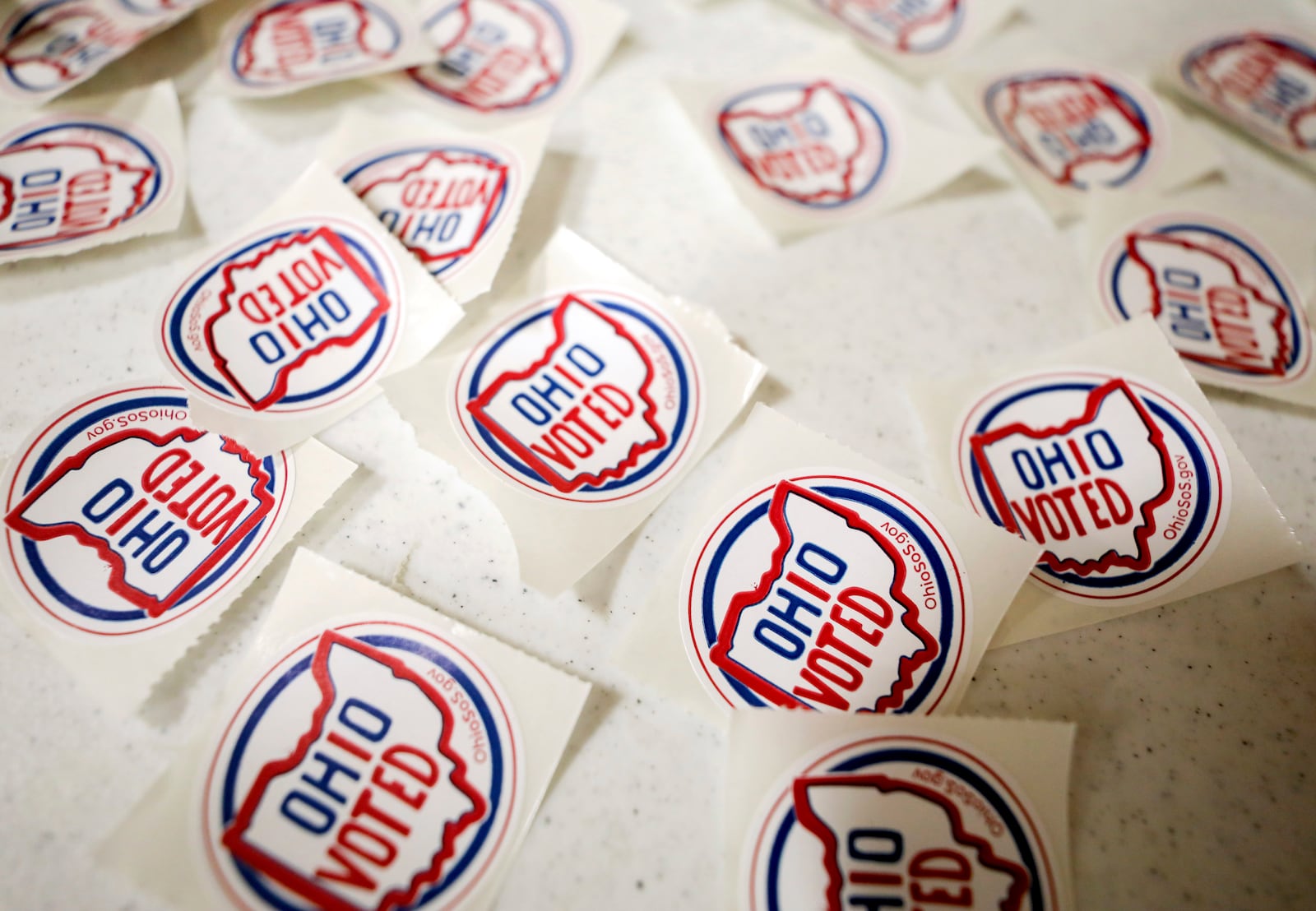 "I voted" stickers are displayed at the exit of the polling site at Toth Elementary School, Tuesday, Aug. 8, 2023 in Perrysburg, Ohio. Ohioans are voting on Issue 1. Voters in Ohio on Tuesday are weighing whether to make it more difficult to change the state's constitution, a decision that will have national implications in the debate over the future of abortion rights in the United States. (Kurt Steiss/The Blade via AP)