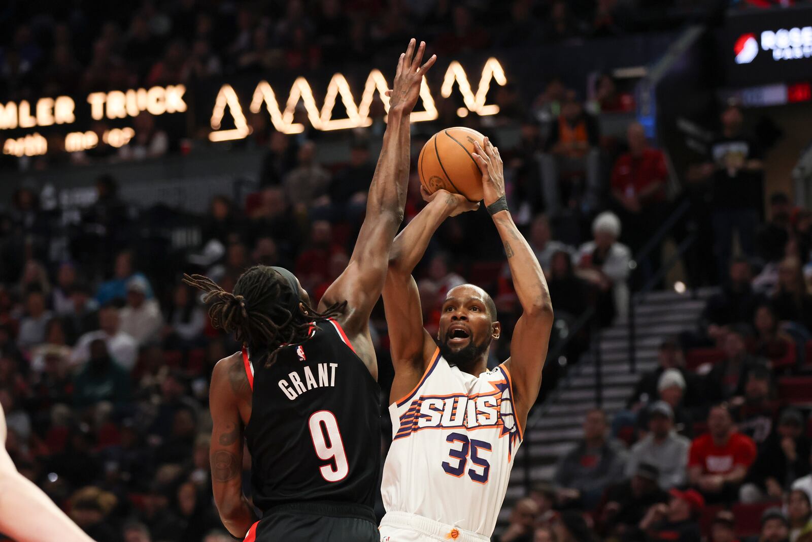 Phoenix Suns forward Kevin Durant (35) shoots over Portland Trail Blazers forward Jerami Grant (9) during the second half of an NBA basketball game Saturday, Feb. 1, 2025, in Portland, Ore. (AP Photo/Amanda Loman)