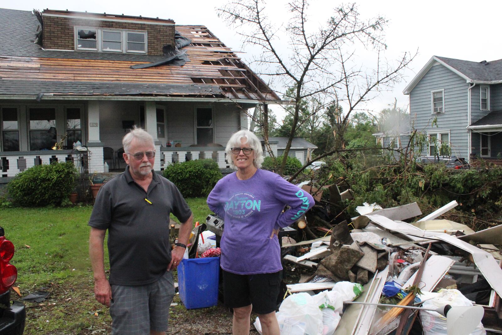 Robin and Chris Sassenberg of Dayton. Friends and volunteers from Oregon District business helped the couple remove debris and secure their Hilldsale Avenue home in the wake of the Memorial Day tornadoes.  Photos by Amelia Robinson