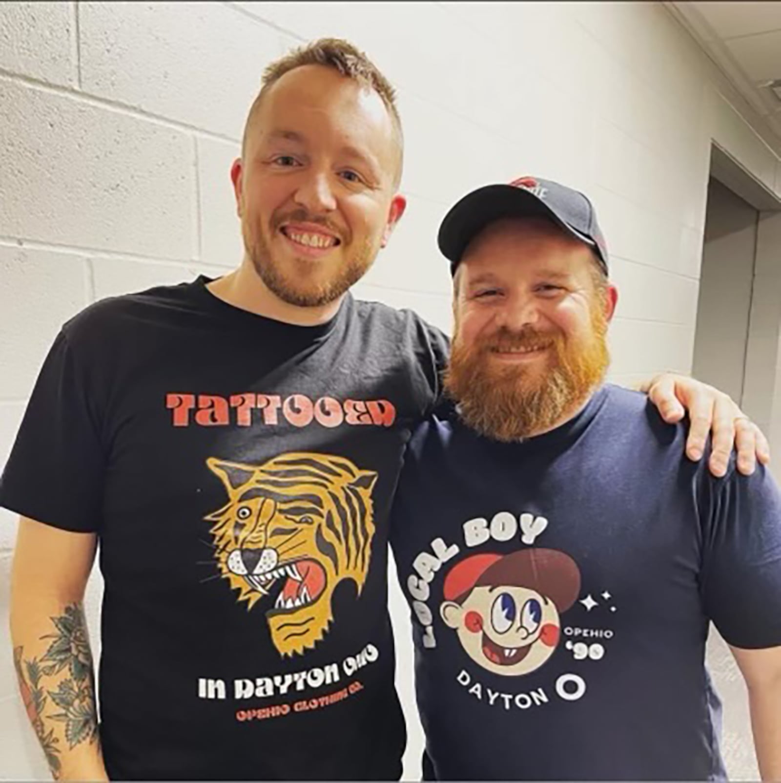 Larry Kennon, left, with his friend from his church worship team, Corey Chadrick, wearing Opehio T-shirts. Kennon launched Opehio in December of 2020. CONTRIBUTED