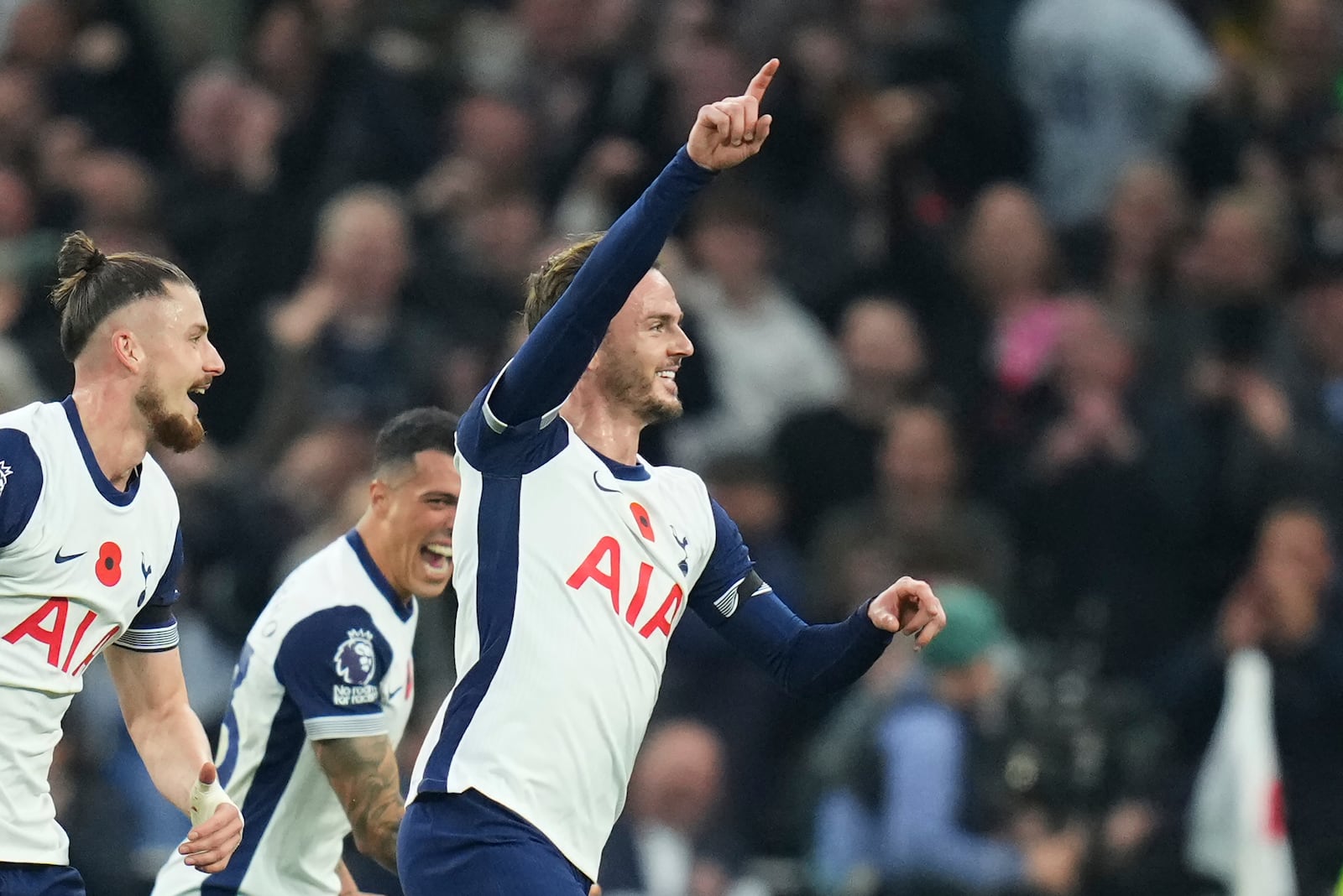 Tottenham's James Maddison, right, celebrates with teammates after scoring his side's fourth goal during the English Premier League soccer match between Tottenham Hotspur and Aston Villa at the Tottenham Hotspur Stadium in London, Sunday, Nov. 3, 2024. (AP Photo/Kirsty Wigglesworth)