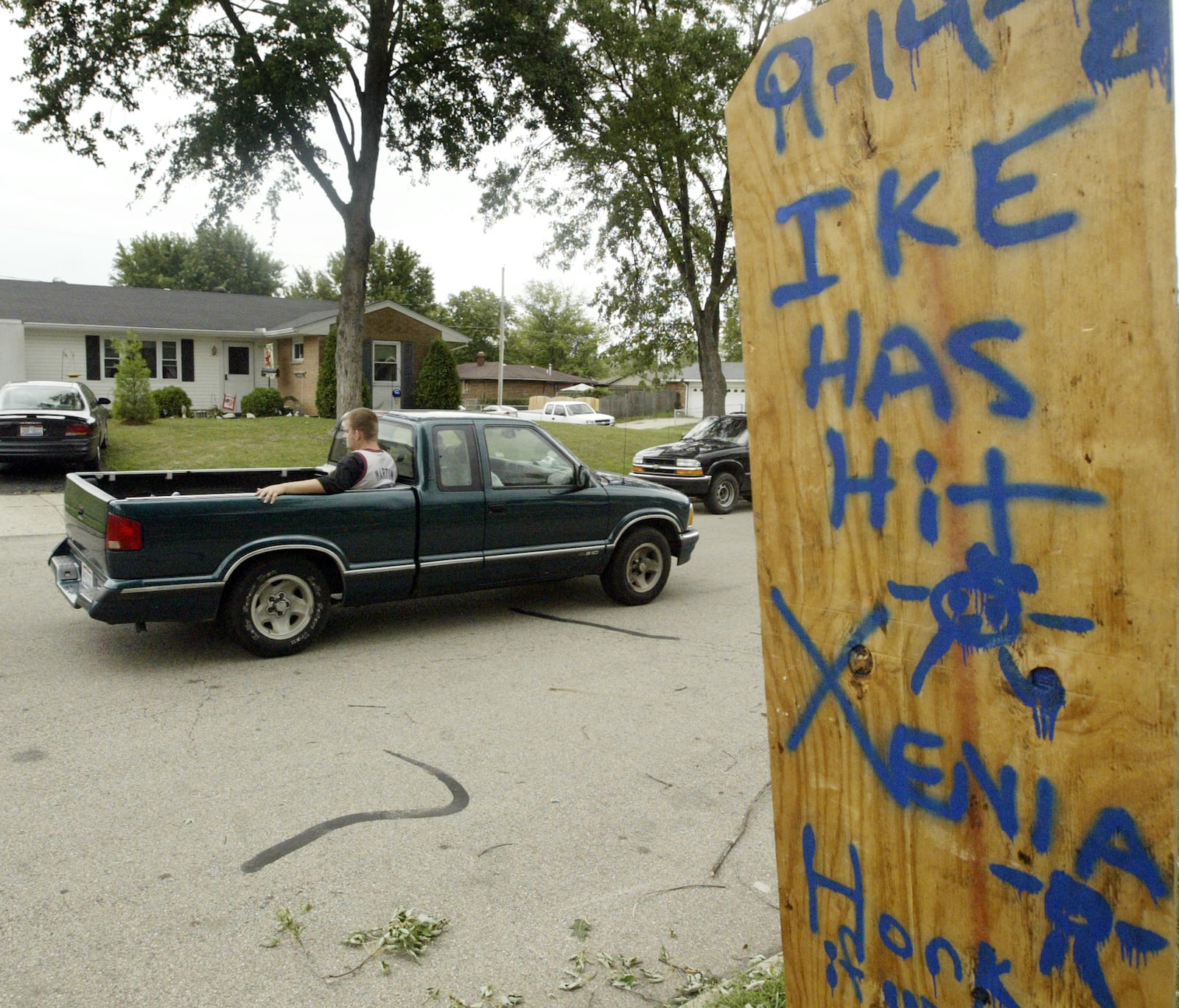 Amy Huber of Xenia, her children and neighborhood made a sign telling all passers-by "9-14-08 Ike has hit Xenia" after the wind storm on September 15. Staff Photo by Teesha McClam