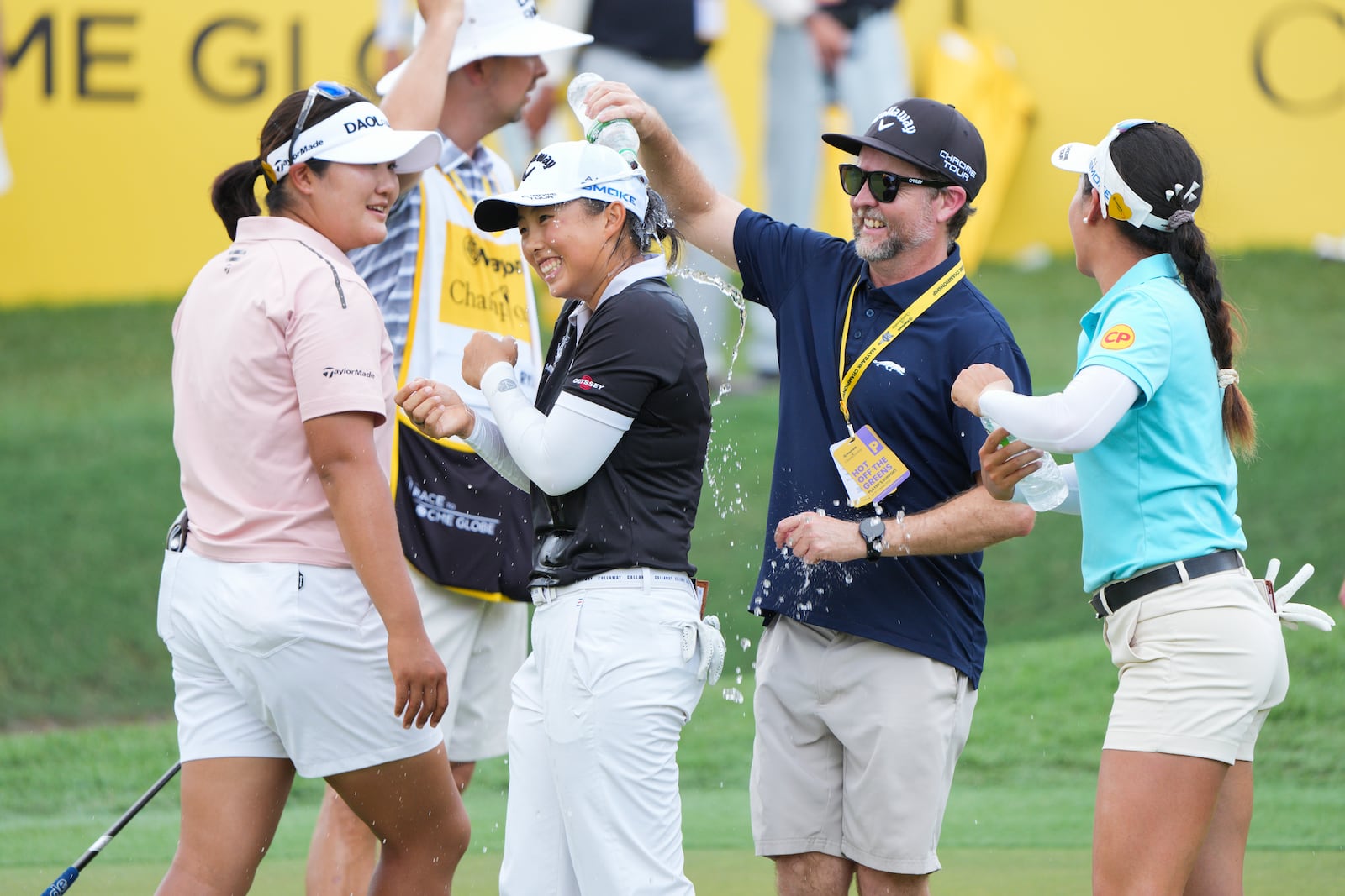 Yin Ruoning of China, centre, celebrates on the 18th hole after winning the LPGA Tour's Maybank Championship at Kuala Lumpur Golf and Country club in Kuala Lumpur, Sunday, Oct. 27, 2024. (AP Photo/Vincent Thian)