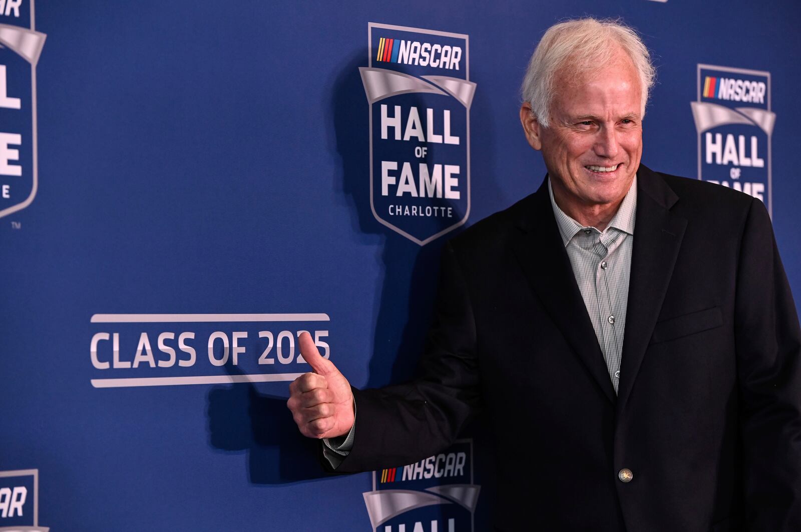 FILE - Former driver Ricky Rudd poses for a photo after learning he was selected for the NASCAR Hall of Fame Class of 2025, Tuesday, May 21, 2024, in Charlotte, N.C. (AP Photo/Matt Kelley, File)