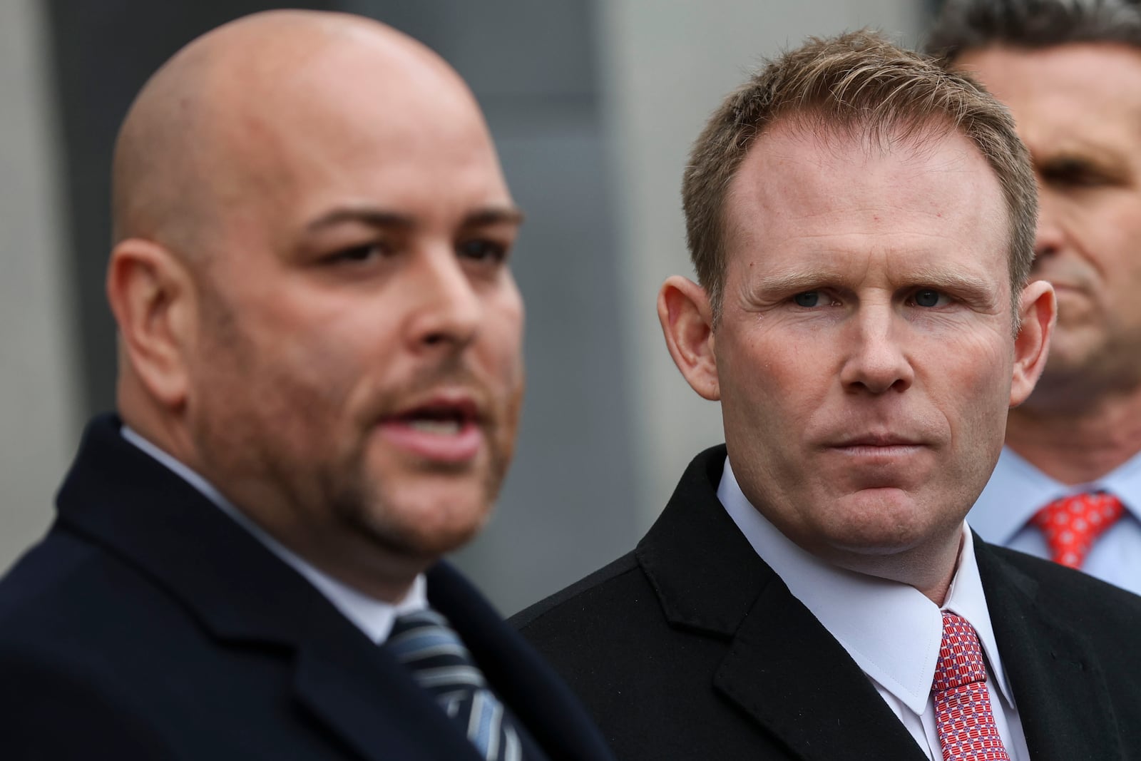 Andrew Giuliani looks on while attorney Joseph Cammarata speaks to the press outside of federal court, Thursday, Jan. 16, 2025, in New York. (AP Photo/Heather Khalifa)